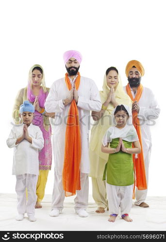 Sikh family praying