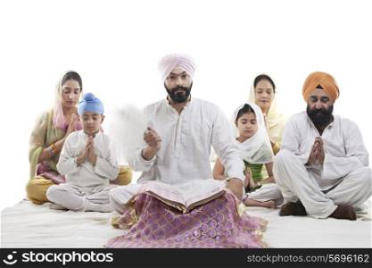 Sikh family praying