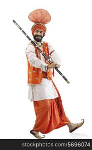 Sikh man holding a Khundi