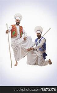 Sikh Man Holding With Khundis