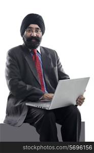 Sikh man with a laptop
