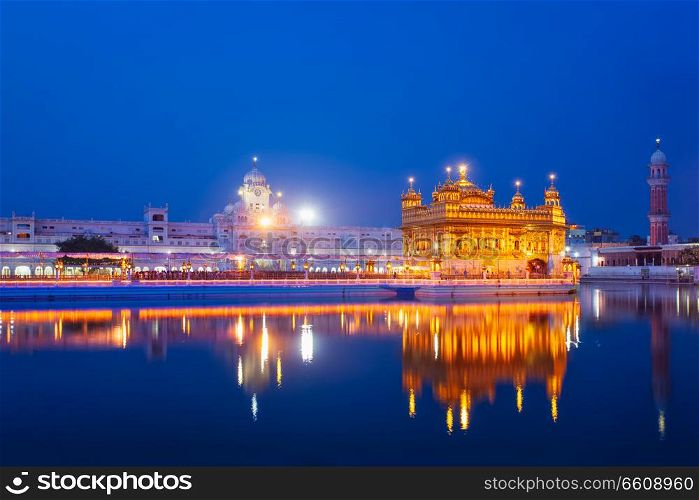 Sikh sacred site gurdwara Sri Harmandir Sahib (also known as The Golden Temple, also Darbar Sahib) illuminated at night. Amritsar, Punjab state, India. Golden Temple, Amritsar