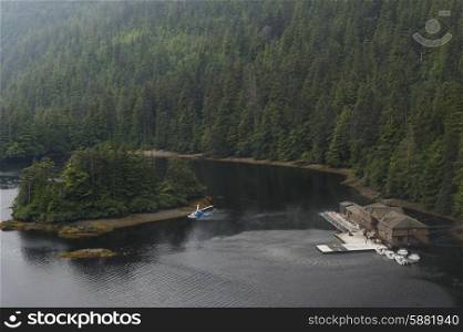 Sikorsky helicopter flying over a lake, Skeena-Queen Charlotte Regional District, Haida Gwaii, Graham Island, British Columbia, Canada