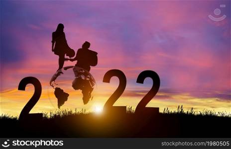 Silhouette 2022 years in sunset background. New Year Celebration for Couple or Partner. Happy New Year and Merry Christmas. Copy space.