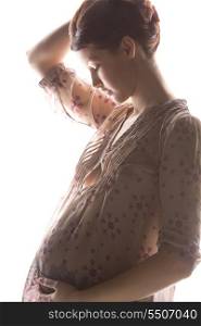 silhouette backlight picture of pregnant beautiful woman
