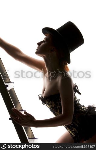 silhouette backlight picture of sexy woman with ladder