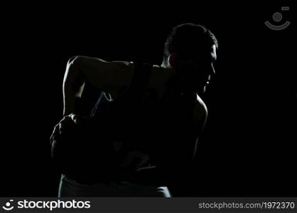 silhouette basketball player holding ball black background. High resolution photo. silhouette basketball player holding ball black background. High quality photo