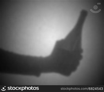 Silhouette behind a transparent paper - Blurred - Bottle of wine