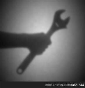 Silhouette behind a transparent paper - Blurred - English wrench