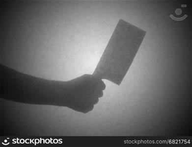Silhouette behind a transparent paper - Cleaver knife