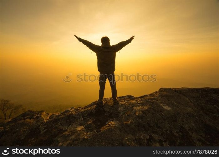 silhouette man standing into sunset sky