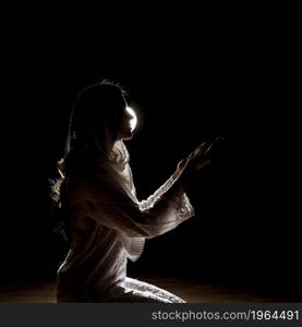 silhouette muslim woman praying. High resolution photo. silhouette muslim woman praying. High quality photo