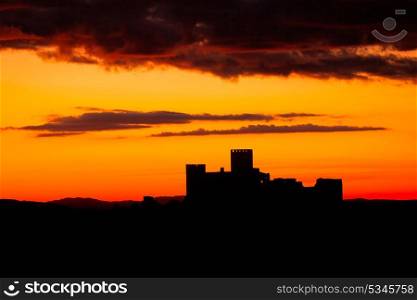 Silhouette of a amazing castle over a red sky