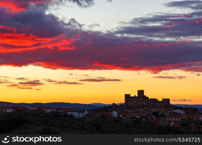 Silhouette of a amazing castle over a yellow sky