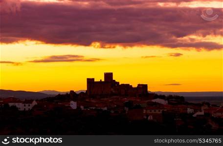 Silhouette of a amazing castle over a yellow sky