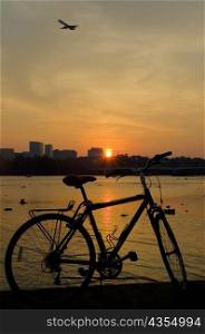 Silhouette of a bicycle at dusk