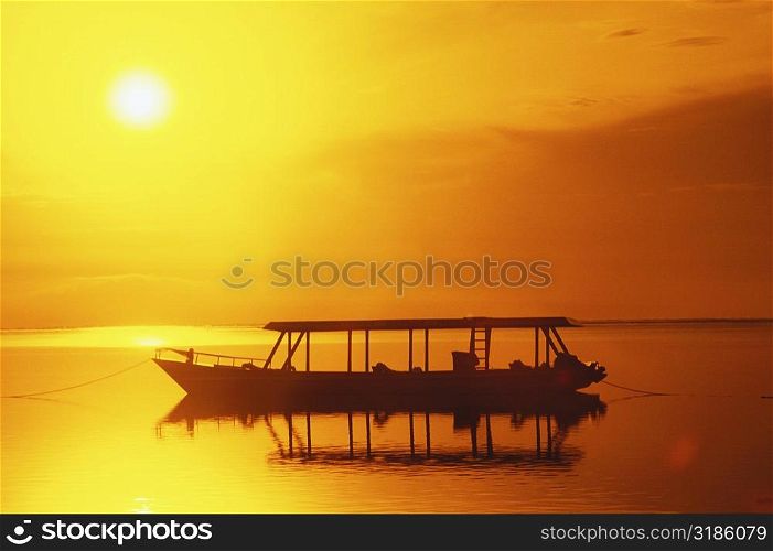 Silhouette of a boat moored in the sea, Bali, Indonesia