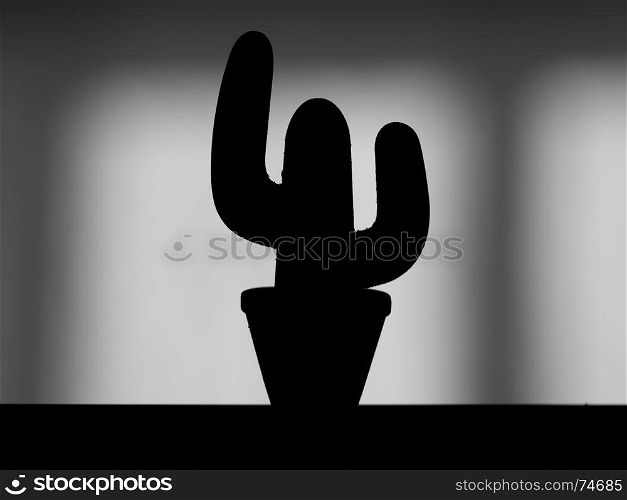 Silhouette of a decorative cactus at home