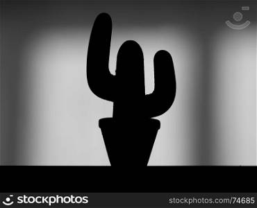 Silhouette of a decorative cactus at home