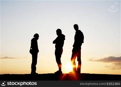 Silhouette of a Group of People on sunset