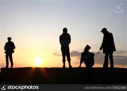 Silhouette of a Group of People on sunset