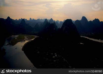 Silhouette of a hill range at dusk, Guilin Hills, XingPing, Yangshuo, Guangxi Province, China