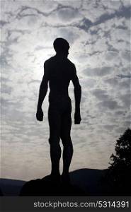 Silhouette of a human statue of granite stone