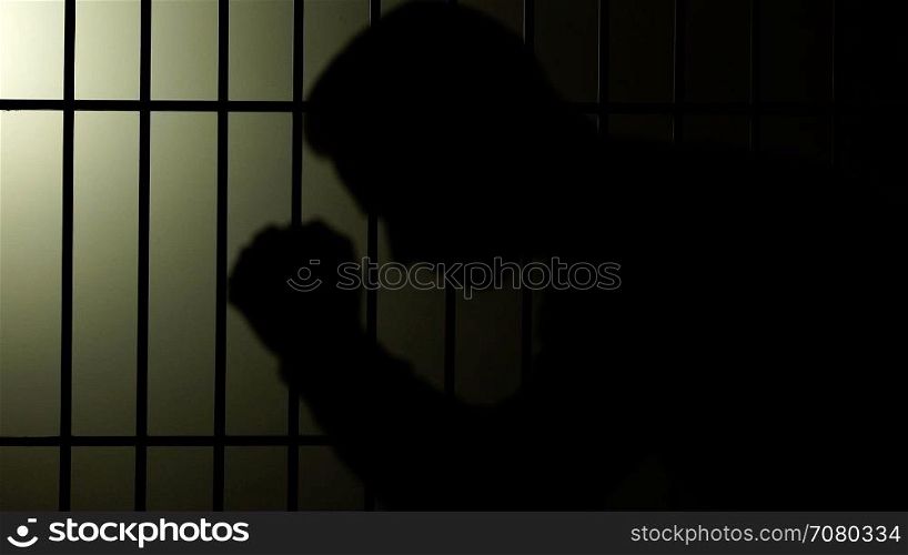 Silhouette of a man in prison