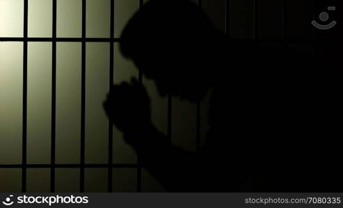 Silhouette of a man in prison