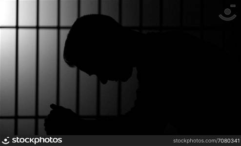 Silhouette of a man in prison (B/W Version)