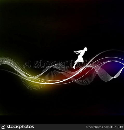 Silhouette of a man on a dark background on the multi-colored lines. Abstraction.