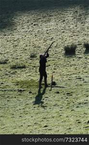 Silhouette of a man shooting 