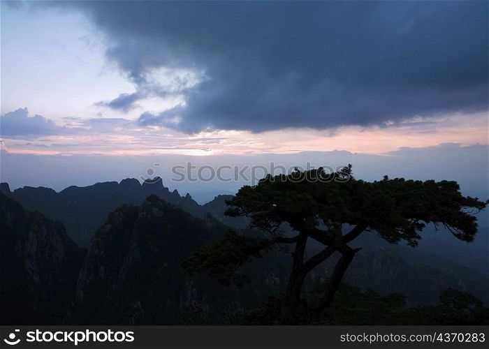 Silhouette of a mountain range at dusk, Huangshan Mountains, Anhui Province, China
