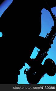 Silhouette of a musician playing the saxophone