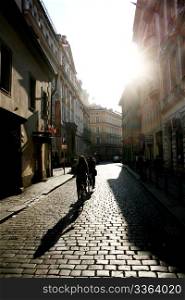 Silhouette of a people riding by bycicle. Prague. Czech Republic