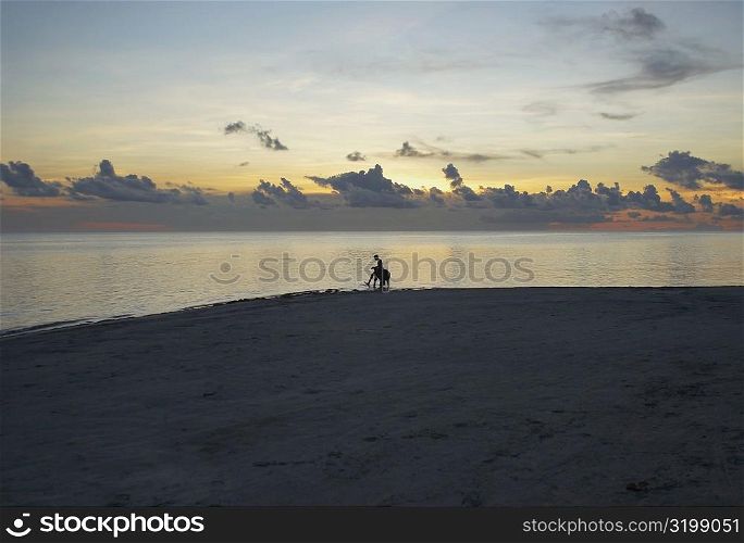 Silhouette of a person on the beach, South West Bay, Providencia, Providencia y Santa Catalina, San Andres y Providencia Department, Colombia