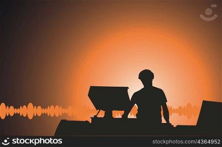 Silhouette of a person standing with a desktop PC