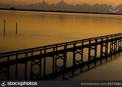 Silhouette of a pier in the sea, St. Augustine Beach, Florida, USA