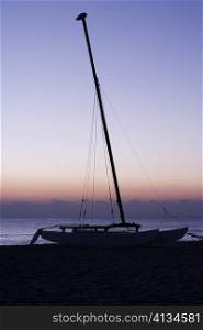 Silhouette of a sailboat on the beach, Miami, Florida, USA