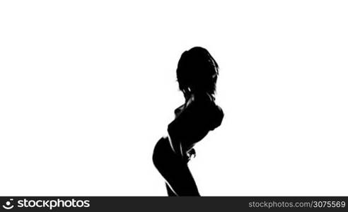 Silhouette of a sexy woman with long hair dancing isolated on white