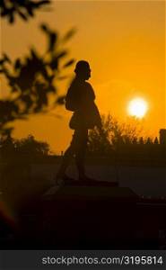 Silhouette of a statue at dusk, St. Augustine, Florida, USA