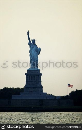Silhouette of a statue at dusk, Statue Of Liberty, New York City, New York State, USA