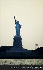 Silhouette of a statue at dusk, Statue Of Liberty, New York City, New York State, USA