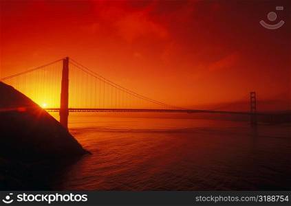 Silhouette of a suspension bridge at dusk, Golden Gate Bridge, San Francisco, California, USA
