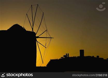 Silhouette of a traditional windmill at dusk, Mykonos, Cyclades Islands, Greece