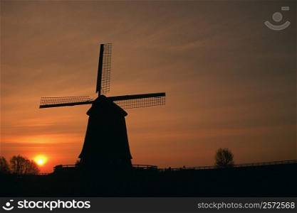 Silhouette of a traditional windmill at dusk, Schermer, Netherlands