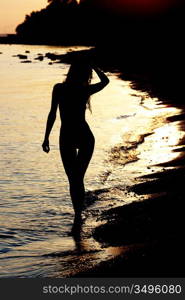 Silhouette of a woman at the beach