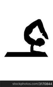 Silhouette Of A Woman Posing On A Yoga Mat