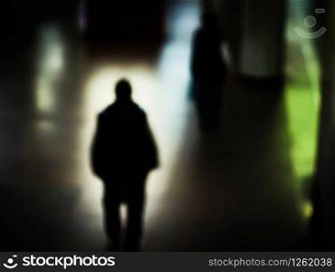Silhouette of a young man in blur. Blurry image of a youg man.