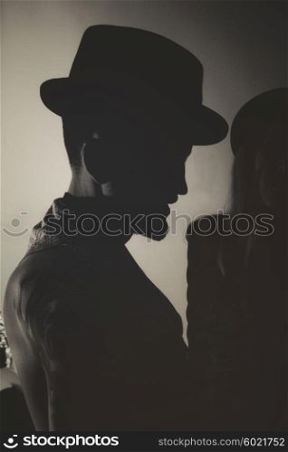 Silhouette of a young man wearing a hat